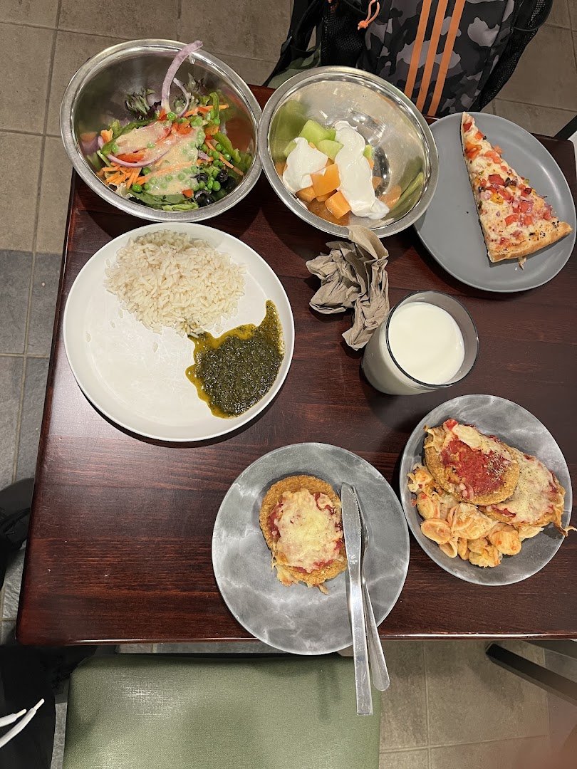 Dining hall seating with simple tables and chairs.