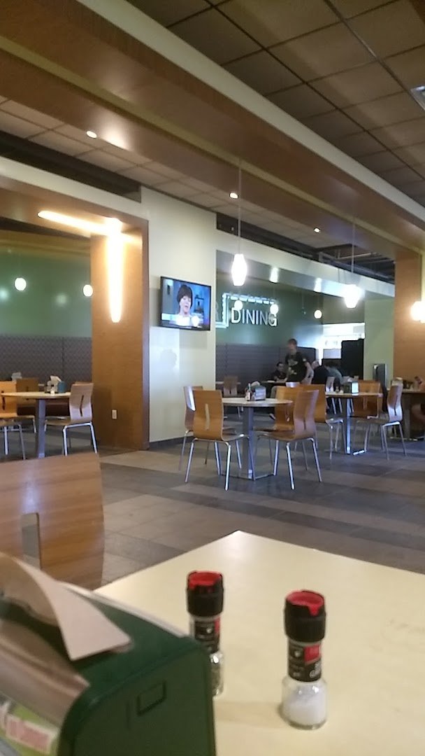 Bright restaurant interior with shared seating.
